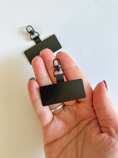 Držák na popruh na telefon (kovový/4 barvy)